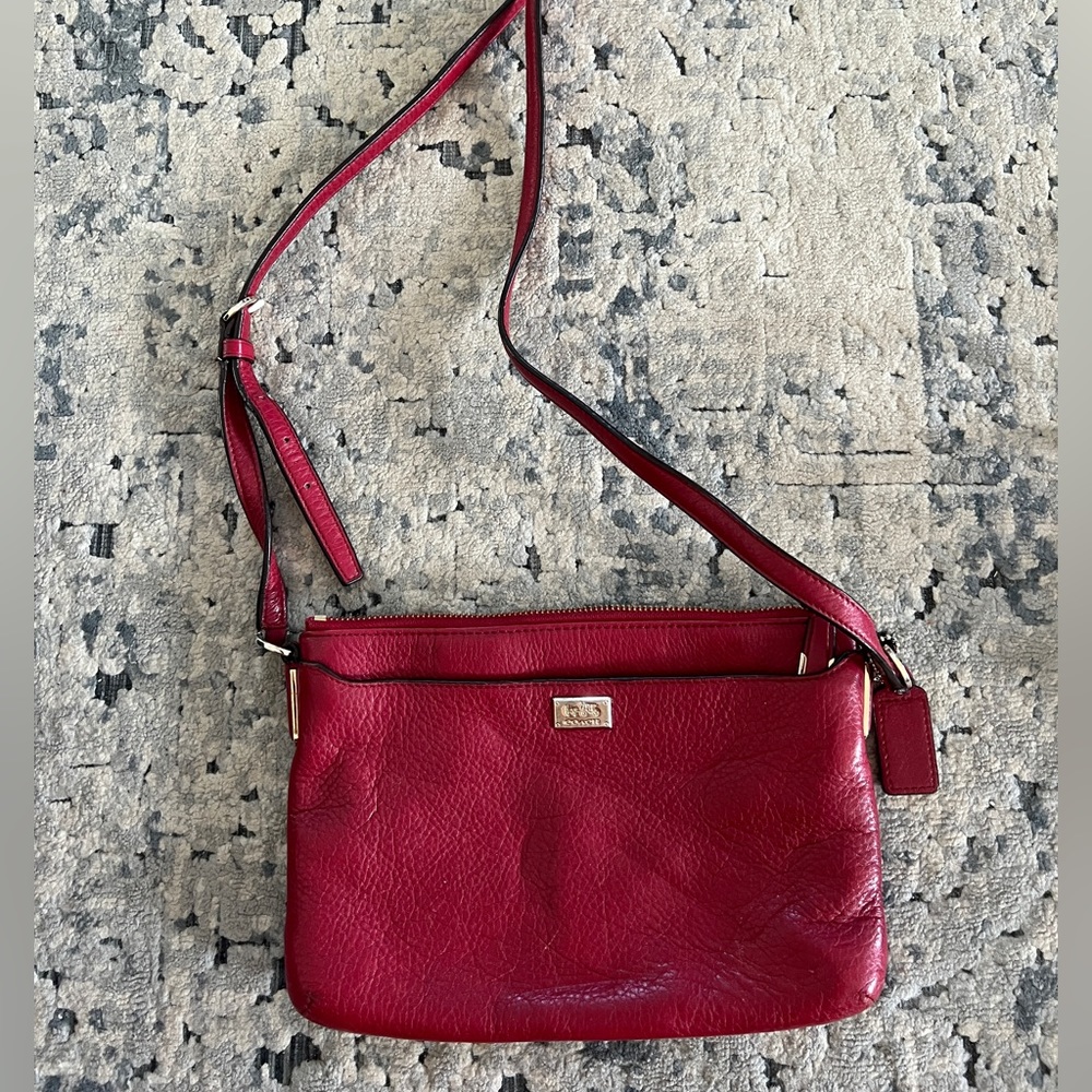 Great used COACH purse! Maroon with gold details with genuine coach leather.